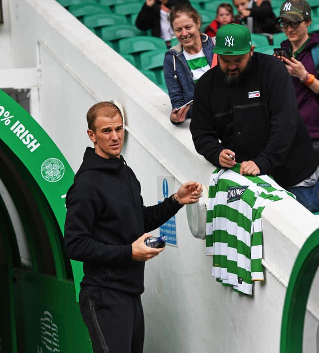 Joe Hart signs an autograph at Celtic Park when there for the Milner/Petrov match for cancer three years ago. Now a player at the Parkhead club, he says he knows from Fraser Forster's experience that, when all is going well, "there aren't many better places to play football". (Photo by Craig Williamson/SNS Group).