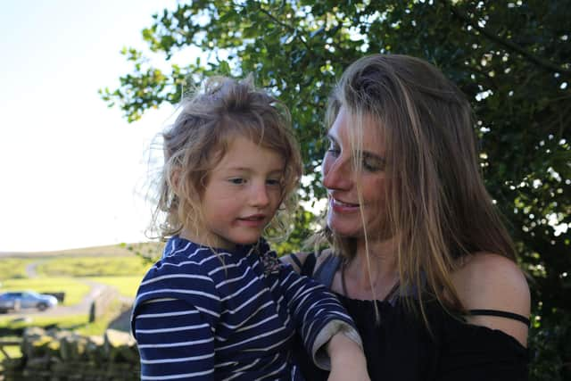 Amanda Owen and her little helper Clemmie down on the farm.