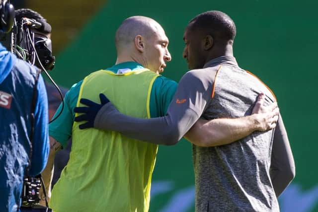 Celtic captain Scott Brown (left) embrace Rangers' Glen Kamara pre match during the Scottish Premiership match between Celtic and Rangers at Celtic Park, on March 21, 2021, in Glasgow, Scotland. (Photo by Craig Williamson / SNS Group)