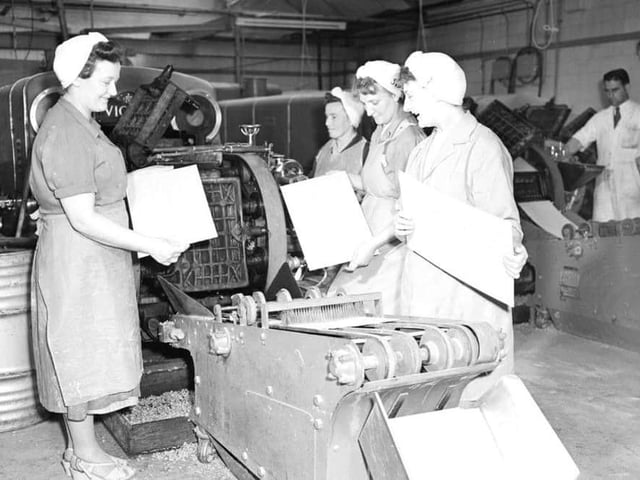 A sheet of wafer biscuit for the caramel wafer comes off machine in the factory.