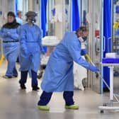 NHSClinical staff wear Personal Protective Equipment (PPE). Picture: Neil Hall/PA Wire