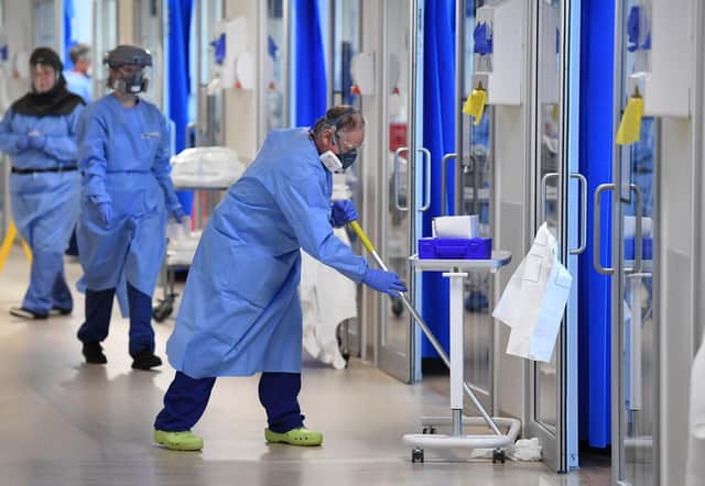 NHSClinical staff wear Personal Protective Equipment (PPE). Picture: Neil Hall/PA Wire