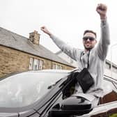 Josh Taylor arrives in his hometown of Prestonpans in East Lothian, and is greeted by fans after becoming four-belt undisputed champion. (Credit: Euan Cherry)