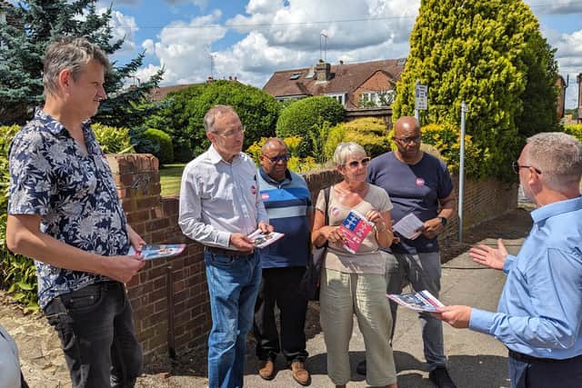 Labour campaigners listen to the shadow justice secretary, Steve Reed.