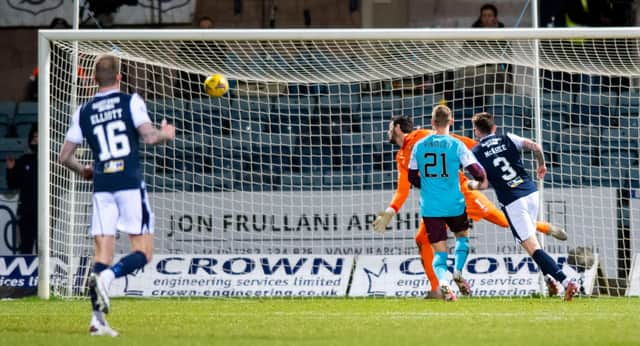Jordan McGhee heads Dundee's first goal against his old club Hearts.