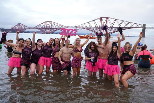 People take part in the Loony Dook New Year's Day dip in the Firth of Forth at South Queensferry