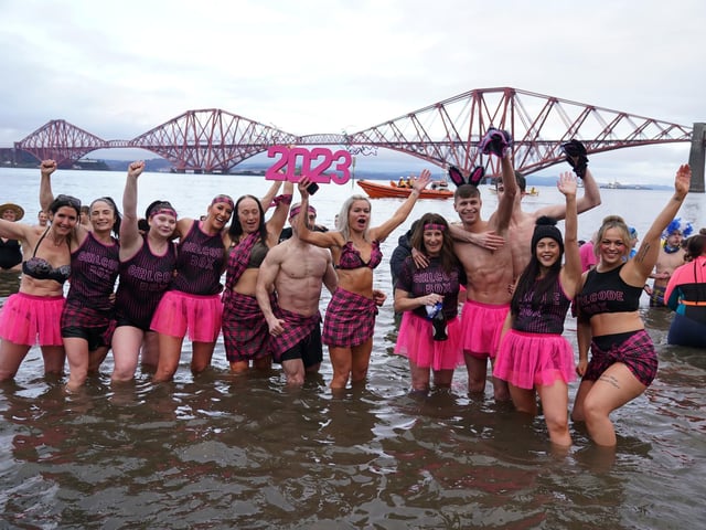 People take part in the Loony Dook New Year's Day dip in the Firth of Forth at South Queensferry