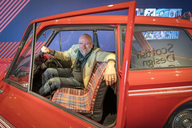 Outlander star Graham McTavish sits inside a limited edition 1976 Caledonia Hillman Imp car which features in the new Tartan exhibition at V&A Dundee. Picture: Jane Barlow/PA Wire