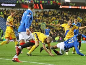Rangers were denied a strong penalty claim when Joe Aribo went down in the box under this challenge from Brondby defender Sigurd Rosted at Ibrox. (Photo by Craig Williamson / SNS Group)