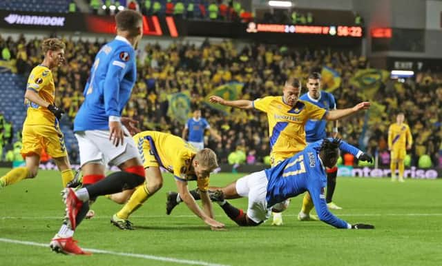 Rangers were denied a strong penalty claim when Joe Aribo went down in the box under this challenge from Brondby defender Sigurd Rosted at Ibrox. (Photo by Craig Williamson / SNS Group)