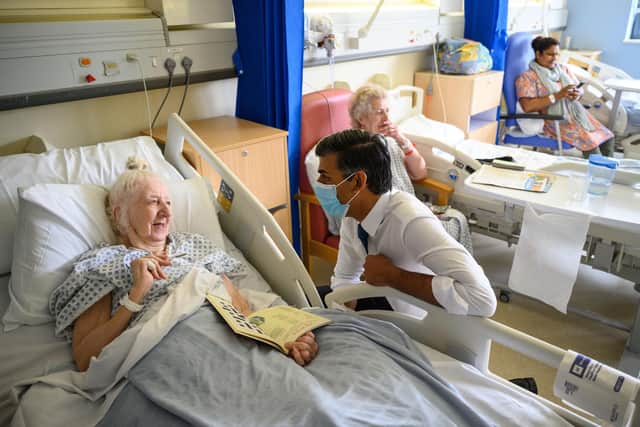 Prime Minister Rishi Sunak speaks with patient Brenda Boyling during a visit to Croydon University Hospital in south London. Picture: Leon Neal/PA Wire