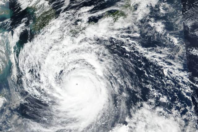 A satellite image released by NASA shows Typhoon Nanmadol, which has now made landfall in japan