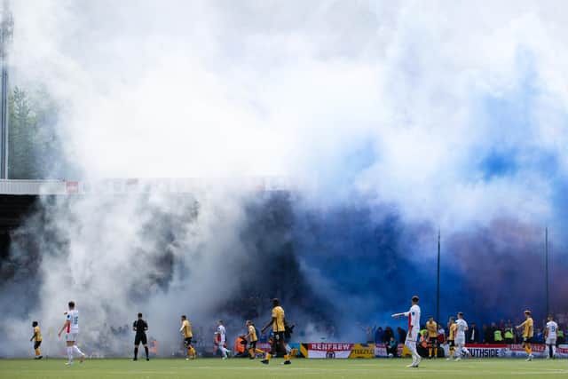 OK, we know that pyrotechnics aren't supposed to have a place in Scottish football, but the smoke bomb display at kick-off of Rangers' opening league day trip to Livingston  Rangers created quite the scene.  (Photo by Alan Harvey / SNS Group)