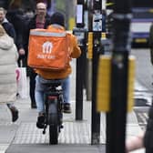 A delivery rider on a pavement in Glasgow city centre on Friday (Photo by John Devlin/The Scotsman)
