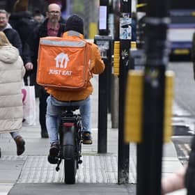 A delivery rider on a pavement in Glasgow city centre on Friday (Photo by John Devlin/The Scotsman)