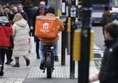 A delivery rider on a pavement in Glasgow city centre on Friday (Photo by John Devlin/The Scotsman)