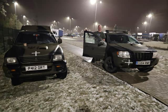 Andrew Harrold and two of the vehicles he has taken to Ukraine to donate to military units.