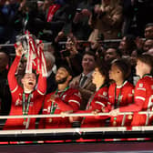 Andy Robertson, centre, lifts the Carabao Cup after Liverpool overcame Chelsea at Wembley.