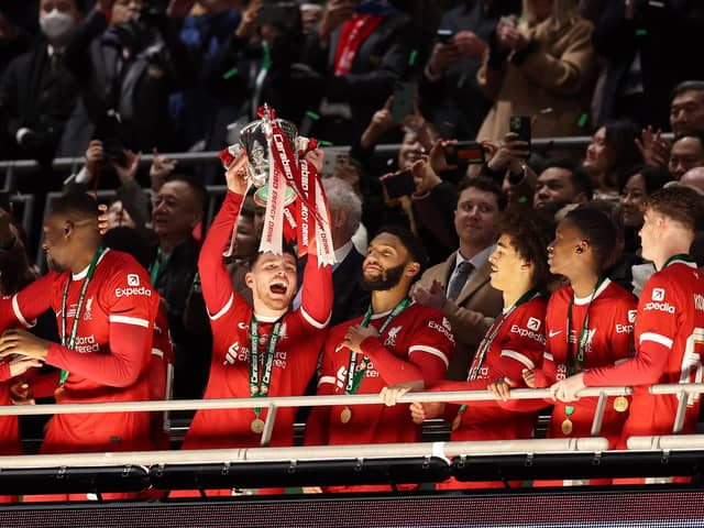 Andy Robertson, centre, lifts the Carabao Cup after Liverpool overcame Chelsea at Wembley.