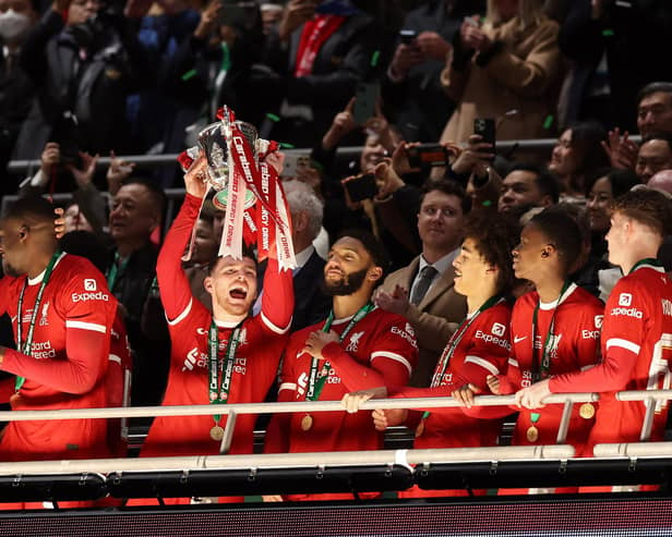 Andy Robertson, centre, lifts the Carabao Cup after Liverpool overcame Chelsea at Wembley.