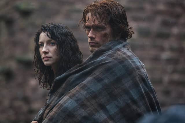 Sam Heughan (right) and Caitriona Balfe star in a scene from Outlander.
