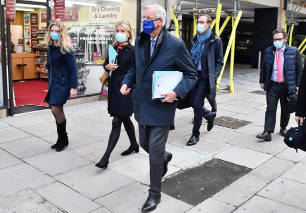 EU chief Brexit negotiator Michel Barnier, wearing an EU flag-themed facemask due to the novel coronavirus pandemic, leaves a hotel in London. Picture: Justin Tallis/AFP via Getty Images
