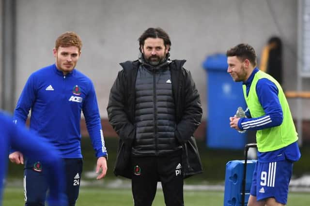 Cove Rangers Fraser Fyvie, manager Paul Hartley and Mitch Megginson warm up ahead of the Scottish Cup tie between Alloa Athletic and Cove Rangers at The Indodrill Stadium, on January 09, 2021, in Alloa, Scotland. (Photo by Mark Scates / SNS Group)