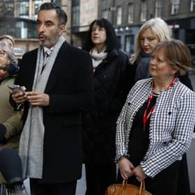 Solicitor Aamer Anwar and members of Scottish Covid Bereaved read a statement outside the UK Covid inquiry. Picture: Jeff J Mitchell/Getty Images