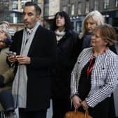 Solicitor Aamer Anwar and members of Scottish Covid Bereaved read a statement outside the UK Covid inquiry. Picture: Jeff J Mitchell/Getty Images