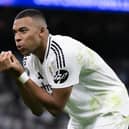 Kylian Mbappé celebrates scoring Real Madrid's first goal during last month's UEFA Champions League match against VfB Stuttgart. The French superstar is involved in a dispute with his previous club over a claim of unpaid wages (Picture: David Ramos/Getty Images)
