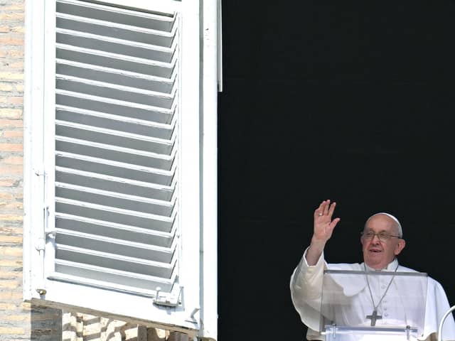 Pope Francis waves to the crowd during the Sunday Angelus prayer in St.Peter's Square at the Vatican on October 15, 2023. (Photo by ALBERTO PIZZOLI/AFP via Getty Images)