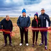 Donald Trump cuts the ribbon on his new McLeod course, which will be designed by Martin Hawtree, left, at Trump International Golf Links in Aberdeenshire.