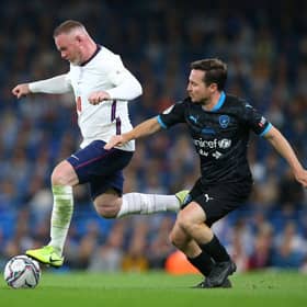 Wayne Rooney of England beats Martin Compston of Soccer Aid World XI during Soccer Aid for Unicef 2021 match between England and Soccer Aid World XI at Etihad Stadium on September 04, 2021 in Manchester, England. (Photo by Alex Livesey/Getty Images)