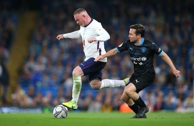 Wayne Rooney of England beats Martin Compston of Soccer Aid World XI during Soccer Aid for Unicef 2021 match between England and Soccer Aid World XI at Etihad Stadium on September 04, 2021 in Manchester, England. (Photo by Alex Livesey/Getty Images)