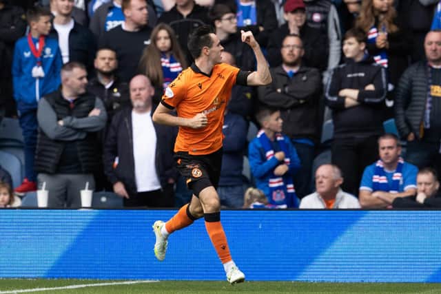 Dundee United full back Liam Smith celebrates pulling a goal back in his side's 2-1 defeat against Rangers on Saturday (Photo by Alan Harvey / SNS Group)
