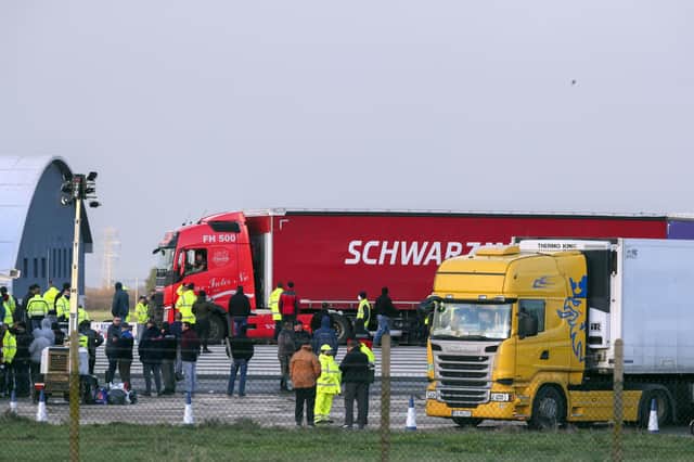 Freight lorries and drivers at Manston airfield, Kent, after French authorities announced that journeys from the UK will be allowed to resume after the coronavirus ban was lifted, but those seeking to travel must have a negative test result.