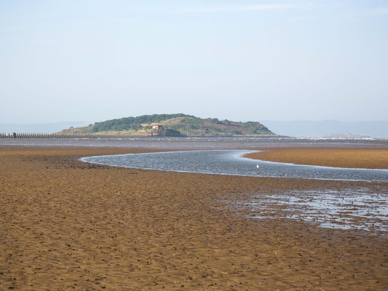 On the outskirts of Edinburgh, Cramond beach is known for its causeway to the island which is only available at low tide. When the sea is out, there is a huge expanse of sand popular with local dog walkers and families, but even when it's in the long promenade is a peaceful walk. Cramond village has a Roman fort, pub, and cafe for refreshments (4,400 searches)