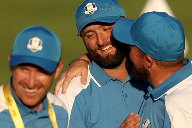 Jon Rahm is congratulated by team-mate Shane Lowry at the end of a dream day for Europe in Rome. Picture: Patrick Smith/Getty Images.