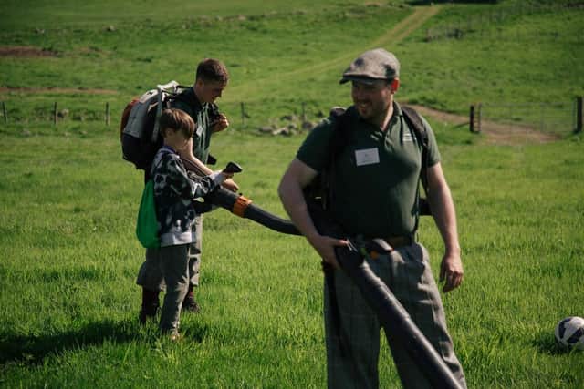 Gamekeepers showing young people the different tools they use for wildfire mitigation practices (pic: Kirk Norbury)