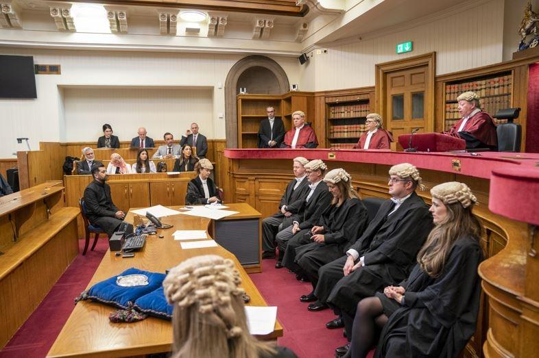 His family watched on from the public gallery, and he was flanked by Lord Advocate Dorothy Bain KC.