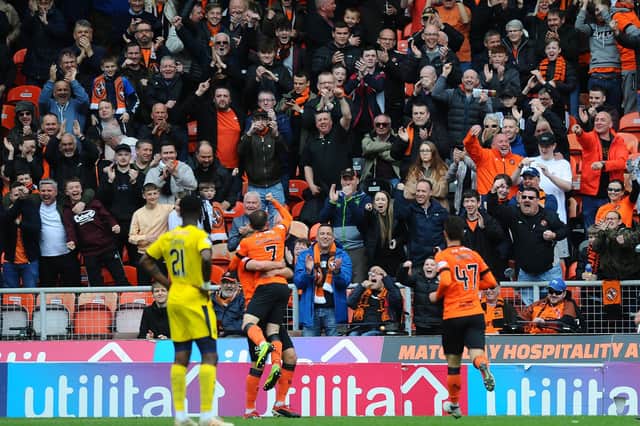 Dundee United fans, including many Scots speakers, celebrate a goal (Picture: Michael Gillen)