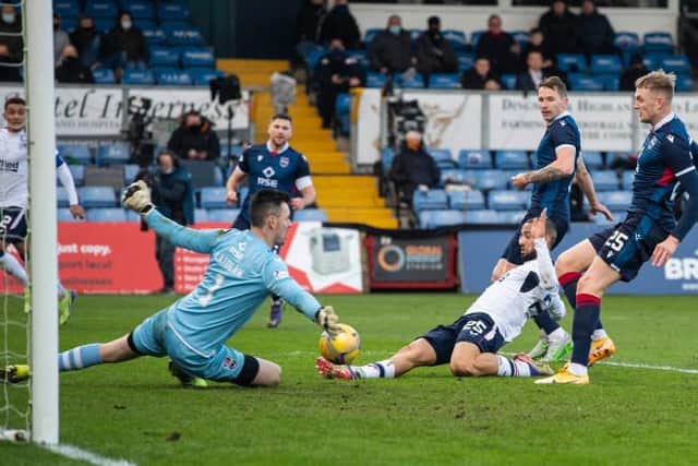 Kemar Roofe stabs home a cross from James Tavernier to put Rangers ahead against Ross County in Dingwall. (Photo by Craig Foy / SNS Group)