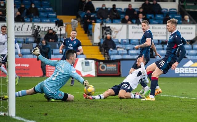 Kemar Roofe stabs home a cross from James Tavernier to put Rangers ahead against Ross County in Dingwall. (Photo by Craig Foy / SNS Group)