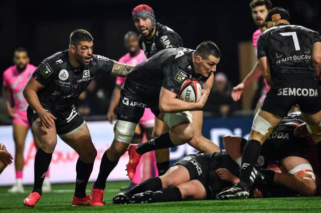 Oyonnax' Scottish lock Ewan Johnson takes the ball into contact during a French Top 14 match against Stade Francais at the Charles-Mathon Stadium in Oyonnax, western France, on February 3, 2024. (Photo by ARNAUD FINISTRE/AFP via Getty Images)