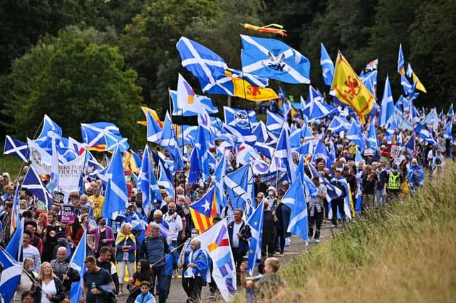 Saltire manufacturers are making a mint from the Independence movement, but would Scots in general benefit? (Picture: Jeff J Mitchell/Getty Images)
