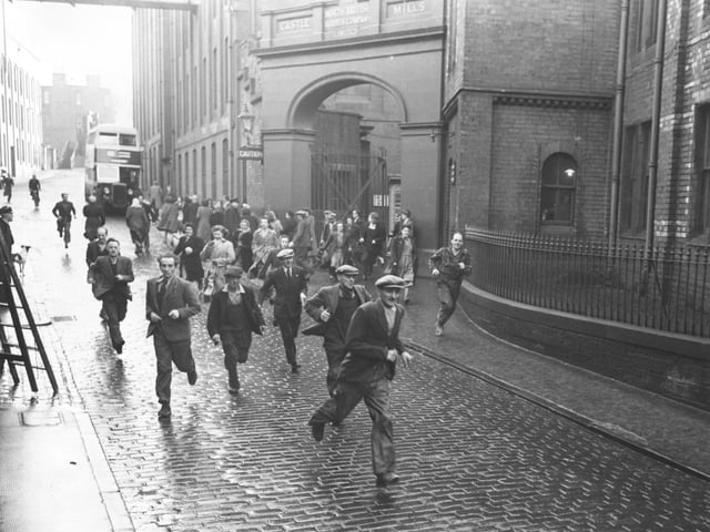 Staff leave the factory in 1951 when the North British Rubber Company's works at Castle Mills employed 3,664 people.