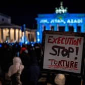 A protester, at a rally in Berlin in support of the popular 'Woman, Life, Freedom' uprising in Iran, calls for an end to torture and execution in the country (Picture: John MacDougall/AFP via Getty Images)