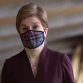 Nicola Sturgeon said people should continue to wear face coverings in shops and on public transport (Picture: Fraser Bremner-Pool/Getty Images)