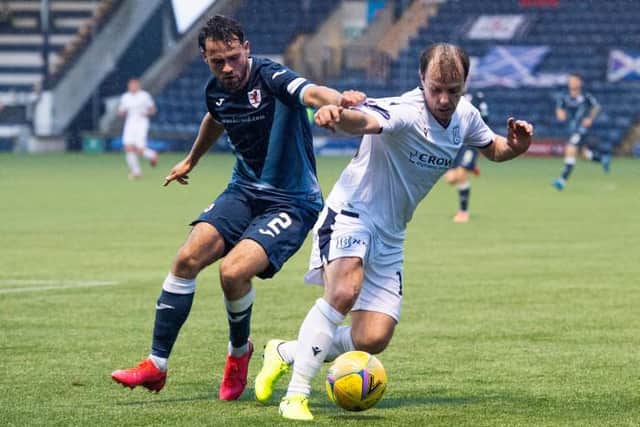 Raith's Reghan Tumilty and Dundee's Paul McGowan in action during the Scottish Premiership play-off match between Raith Rovers and Dundee at Stark's Park on May 12, 2021, in Kirkcaldy, Scotland. (Photo by Euan Cherry / SNS Group)