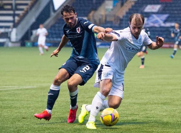 Raith's Reghan Tumilty and Dundee's Paul McGowan in action during the Scottish Premiership play-off match between Raith Rovers and Dundee at Stark's Park on May 12, 2021, in Kirkcaldy, Scotland. (Photo by Euan Cherry / SNS Group)